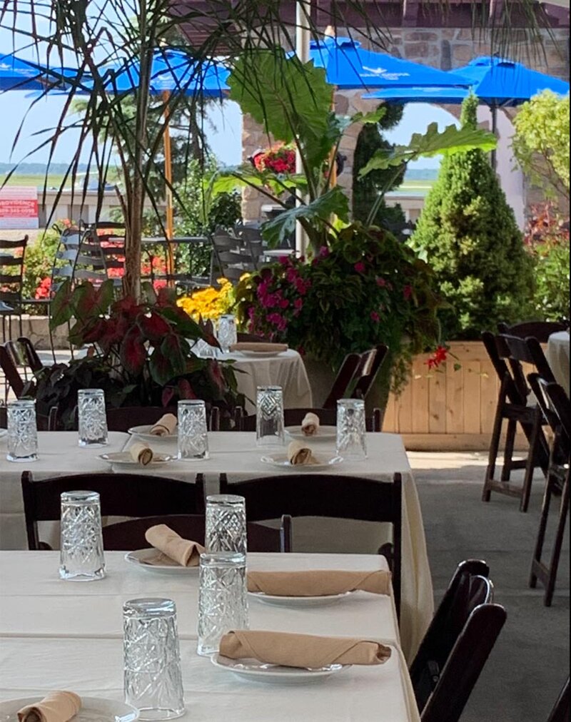 Outside dining area facing the bay and umbrella set up