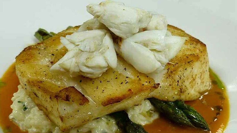 Chilean seabass topped with jumbo lump crabmeat over risotto and asparagus